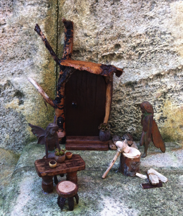 Fairy Door with sign, fire wood, axe, table and stools.